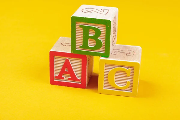 Alphabet blocks ABC close up, education concept