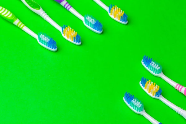 toothbrush on green background, dental care concept