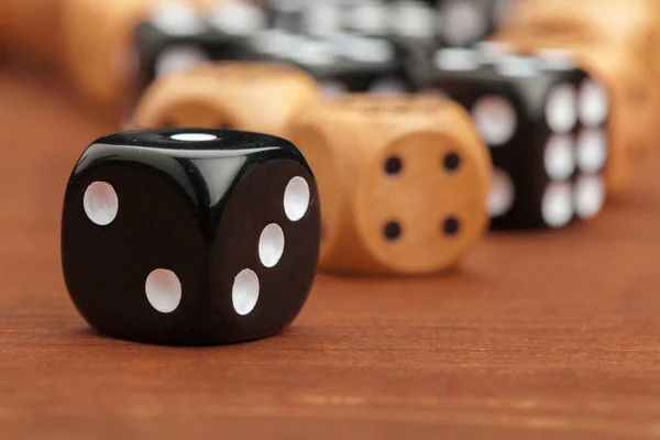 Dice on a wooden table. Concept for business risk.
