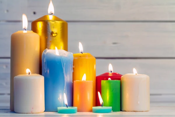 home lighting candles on wooden table