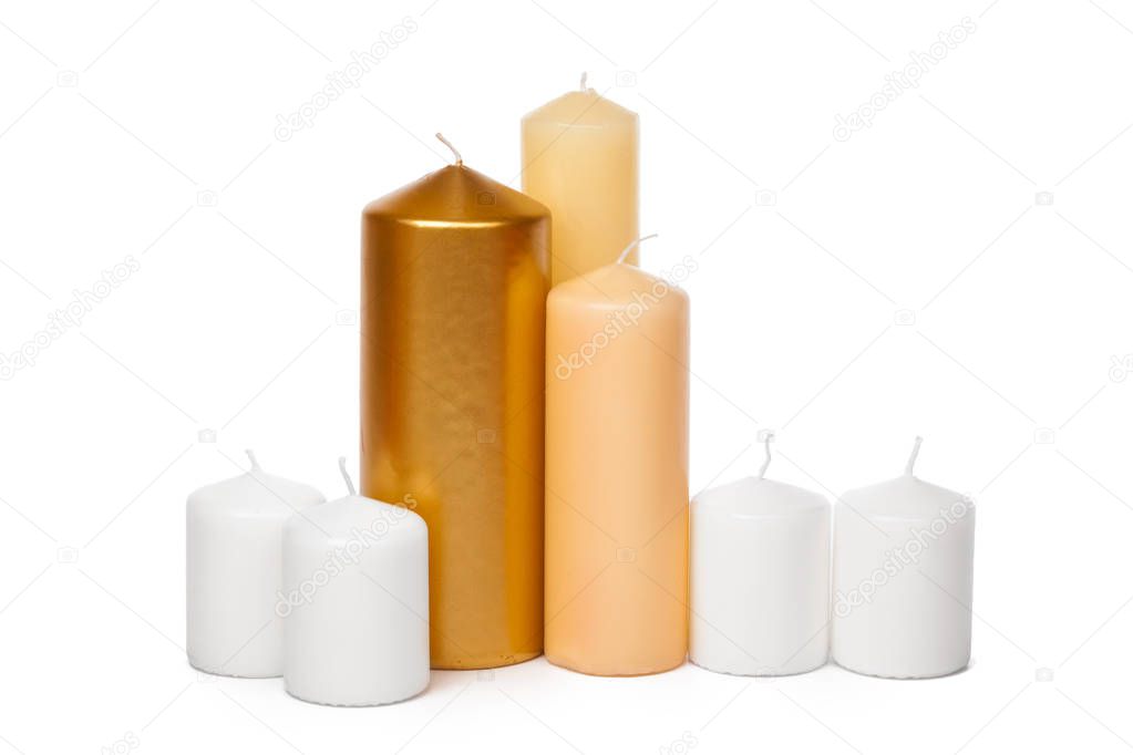 different sized candles on a white background 