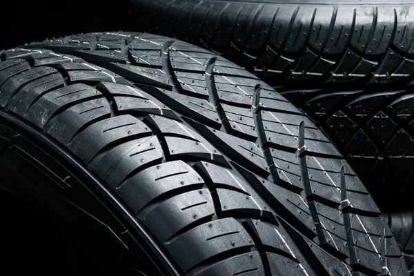 New tyres background. Car tyres close up