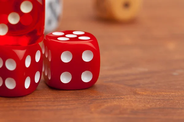 Dice on a wooden table. Concept for business risk.