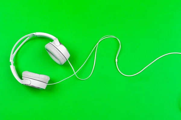 White Headphones Cord Bright Green Background — Stock Photo, Image