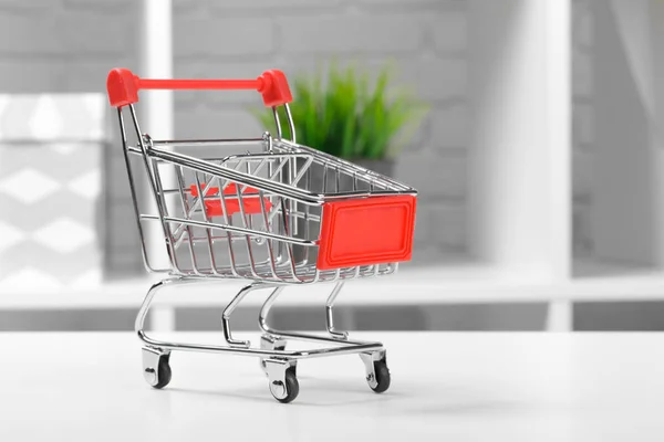 Mini Shopping Cart On The Table.