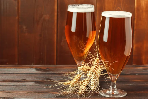 Glass beer on wood background