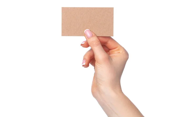 Piękna kobieta ręka trzyma białą wizytówkę na białym tle — Zdjęcie stockowe