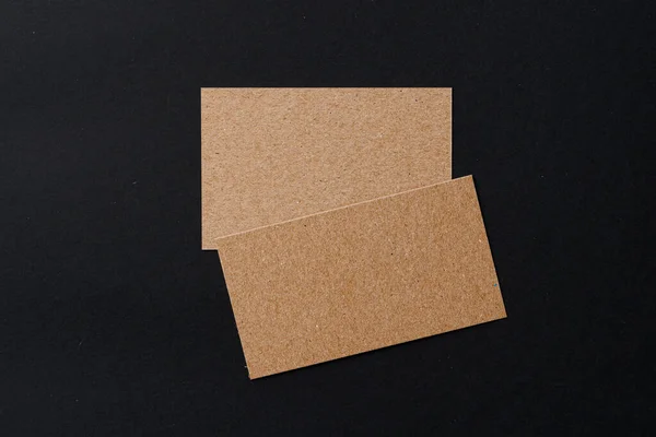 Business card of a craft paper on black background — Stock Photo, Image