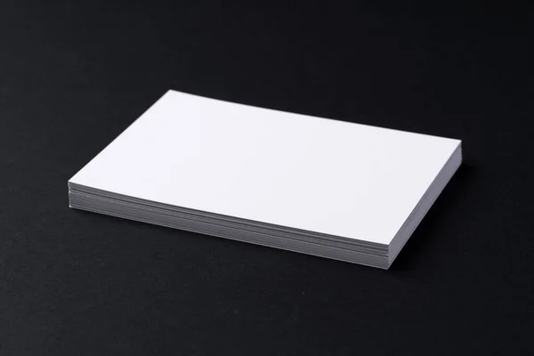 White blank business cards on dark black background — Stock Photo, Image