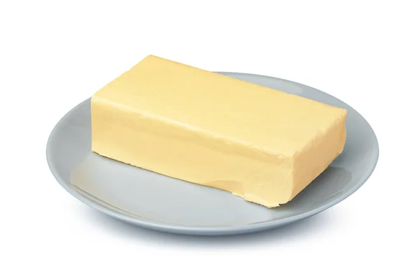 Масло на белой пластине изолировано на белом фоне Стоковая Картинка