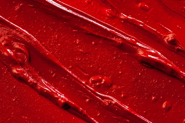 Piros rúzs háttér textúra elmosódott. Közelről.. — Stock Fotó