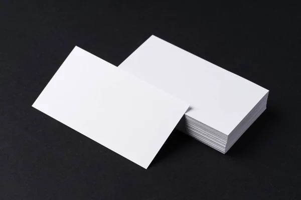 White blank business cards on dark black background — Stock Photo, Image