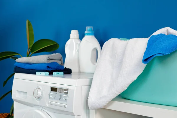 Bottle of detergent whith washing machine, indoors — Stock Photo, Image