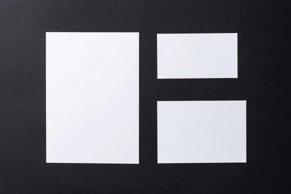White blank business cards on dark black background — Stock Photo, Image