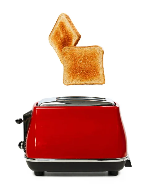 Dwa tosty wyskakujące z czerwonego tostera na białym tle — Zdjęcie stockowe