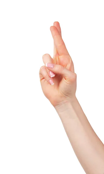 Main féminine avec doigts croisés pour la chance — Photo
