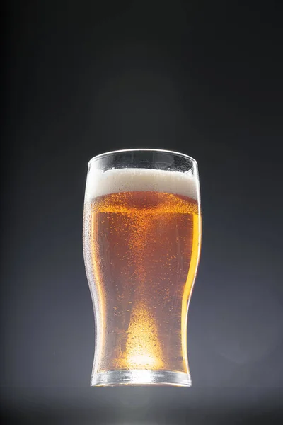 Glass of beer on black background, copy space — Stock Photo, Image