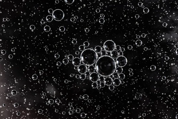 Black oil drops on the water surface. — Stock Photo, Image