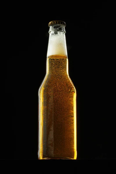 Beer bottle on dark background, copy space — Stock Photo, Image