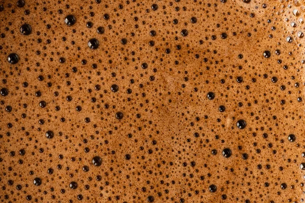 Brown coffee foam with bubles top view — Stock Photo, Image