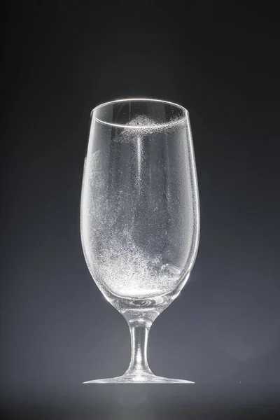 Empty glass on black background, copy space — Stock Photo, Image