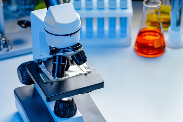 Microscope lenses on a laboratory desk close up