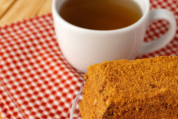 Piece of honey cake on kitchen table