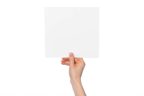 Mano delle donne che mostrano banner di carta bianca isolato su bianco — Foto Stock