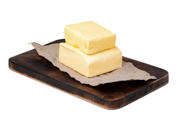 Butter auf Holzbrett isoliert auf weißem Hintergrund — Stockfoto