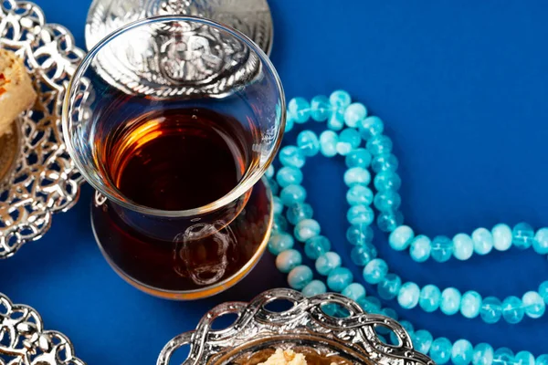 Cup of tea with islamic pray beads