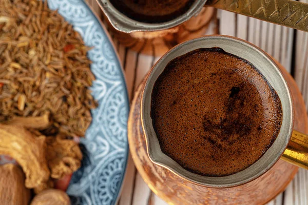 Coffee in metal turk with spices in a plate — Stock Photo, Image