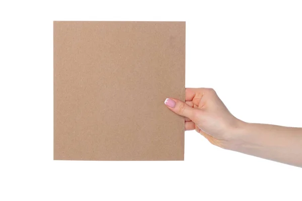 Cartão de papel artesanal na mão feminina isolado em branco — Fotografia de Stock