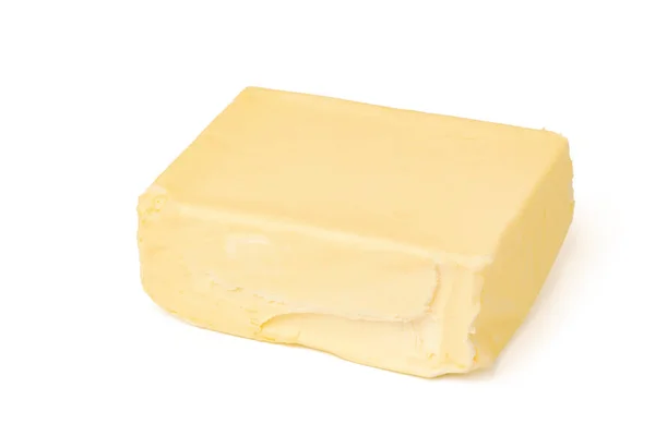 白い背景に隔離されたバターのブロック ロイヤリティフリーのストック写真