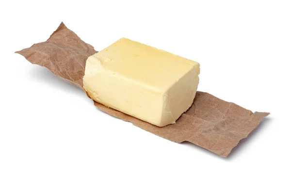 Frische Butter auf Bastelpapier isoliert auf weißem Hintergrund — Stockfoto