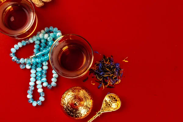 Cup of tea with islamic pray beads