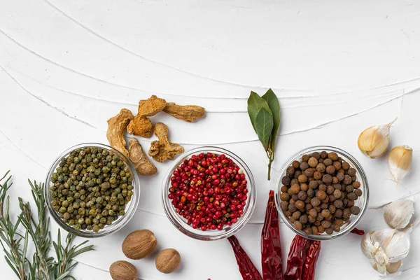 Red chili peppers and other spices on white textured background, top view — Stock Photo, Image