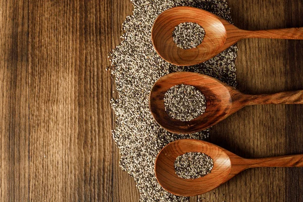 Wooden spoon with chia seeds close up — Stock Photo, Image