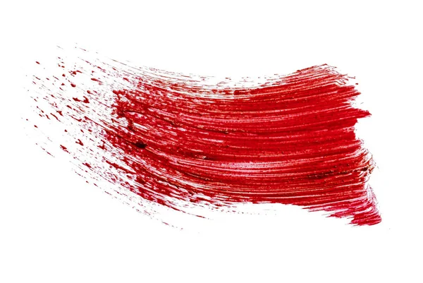 Fleckenmuster eines rot-matten Lippenstifts auf weißem Hintergrund — Stockfoto