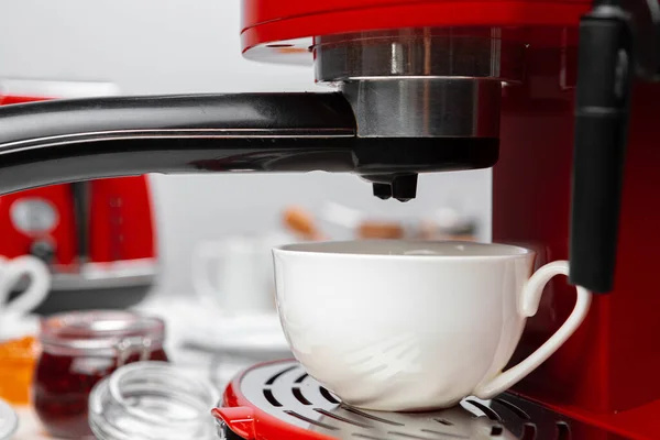 Americano coffee pouring from home coffee machine