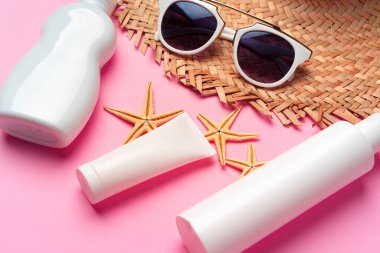 Güneş gözlüğü ve güneş kremi kapatılıyor.