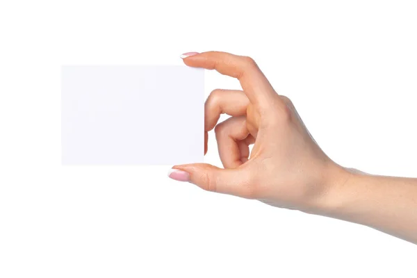 Frauenhand mit leerer weißer Visitenkarte isoliert auf weißer — Stockfoto