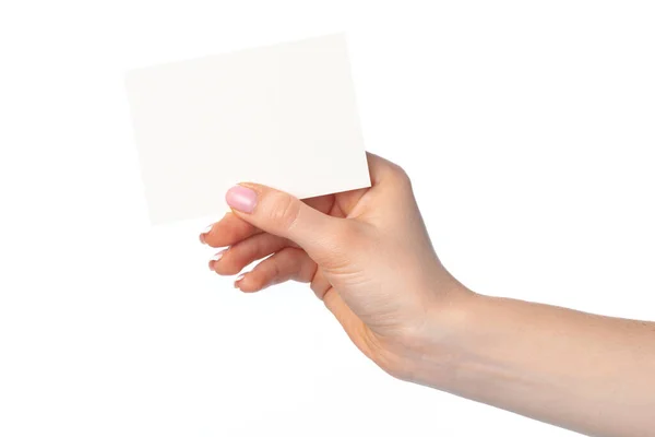 Mano de mujer con tarjeta blanca aislada en blanco — Foto de Stock
