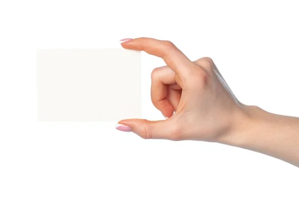 Vrouwen hand met blanco wit visitekaartje geïsoleerd op wit — Stockfoto