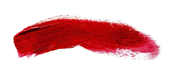 Muestra de mancha de un lápiz labial rojo mate sobre fondo blanco — Foto de Stock
