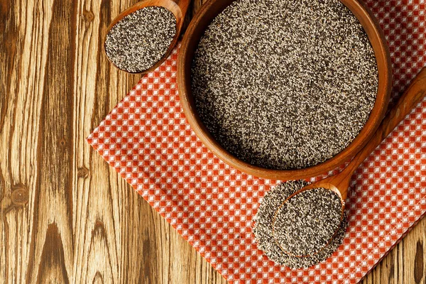 Chia seeds in a bowl with wooden spoon — Stock Photo, Image