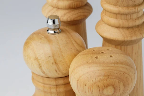 Wooden mills with salt and pepper on white — Stock Photo, Image