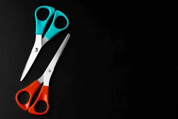 Scissors close up on dark black background — Stock Photo, Image