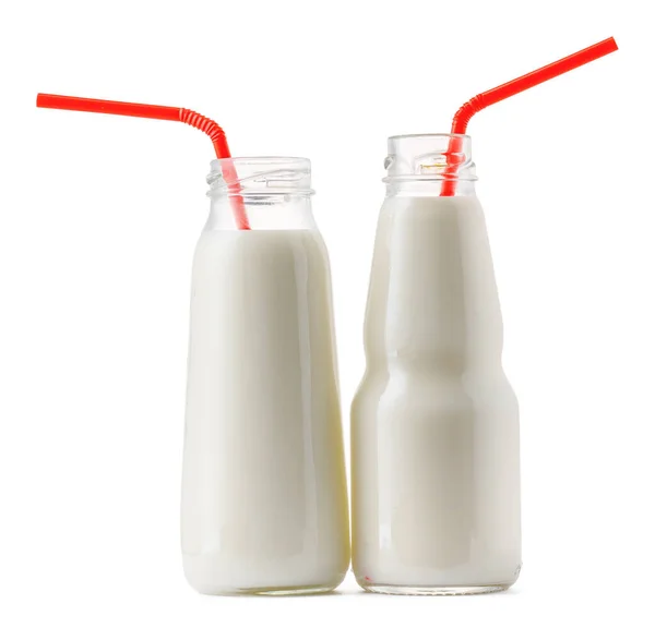 Copo de vidro de leite com uma palha isolada em branco — Fotografia de Stock