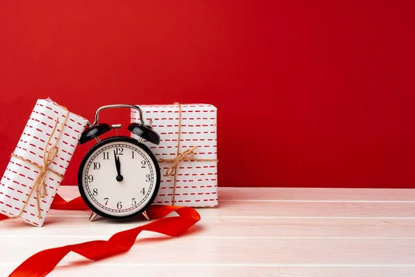Christmas and New Year countdown concept with alarm clock Stock Photo