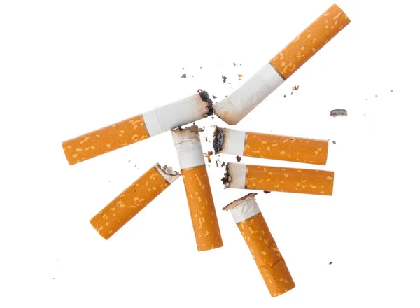 Montón de colillas de cigarrillo extinguidas aisladas en blanco —  Fotos de Stock